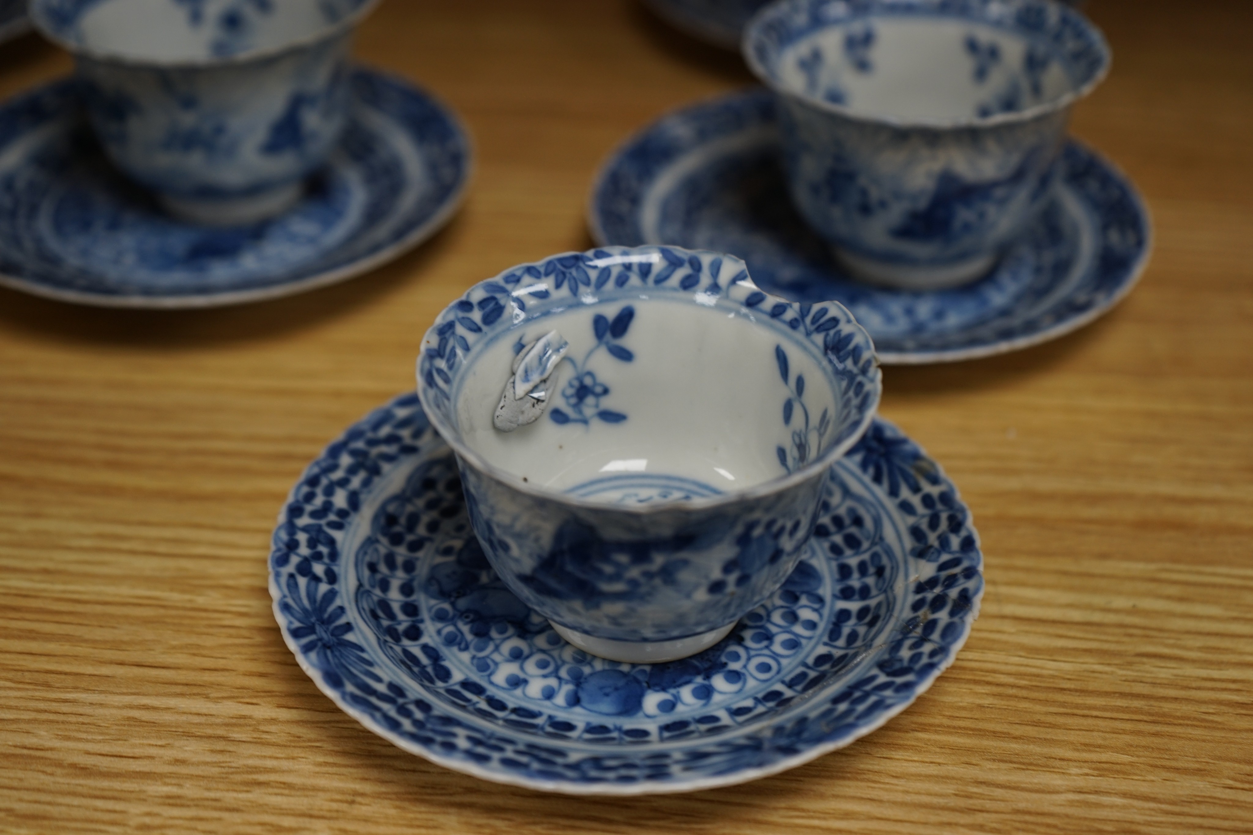 Five 19th century Chinese blue and white tea bowls and saucers, four-character marks to bases